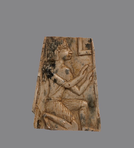 Plaque carved in relief with kneeling figure 1.77 x 1.3 x 0.91 in. (4.5 x 3.3 x 2.31 cm)